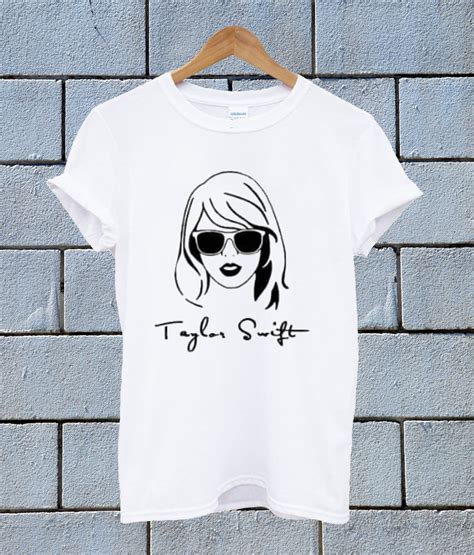 Claim: A picture shows Taylor Swift posing in a T-shirt that shows a cartoonish drawing of former U.S. President Donald Trump's hair and red tie, and reads, &quot;Nope Not Again.&quot;